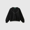 Sweatshirt with jewel-like applique