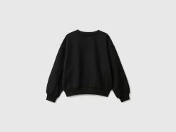 Sweatshirt with jewel-like applique