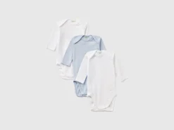 Three solid color bodysuits in organic cotton