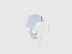 Three solid color bodysuits in organic cotton