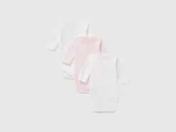 Three solid color bodysuits in organic cotton
