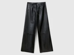 Trousers in imitation leather fabric