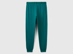 Trousers with elastic logo