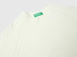 Turtleneck sweater with slits