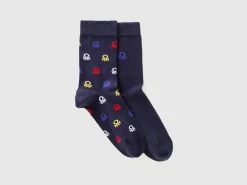 Two pairs of long socks with logos