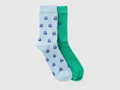Two pairs of long socks with logos