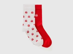 Two pairs of long socks with logos