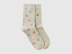 Two pairs of long socks with logos