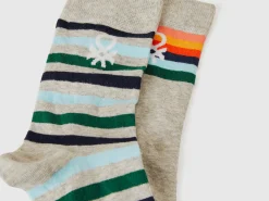 Two pairs of long socks with logos
