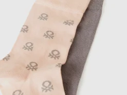 Two pairs of long socks with logos
