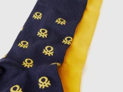Two pairs of long socks with logos