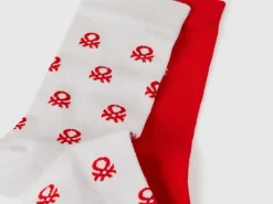 Two pairs of long socks with logos