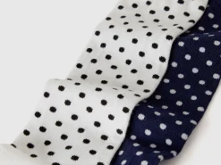 Two pairs of polka dot socks